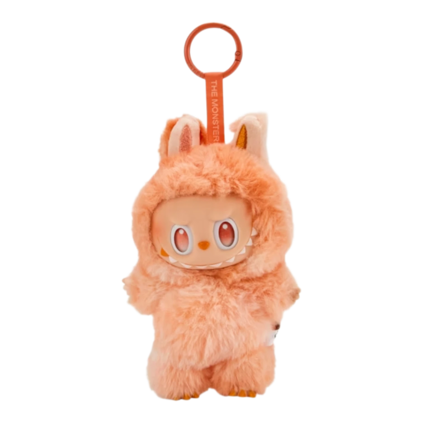Squish Planet orange fuzzy Labubu monster pendant with big eyes and sharp teeth, attached to a keyring.