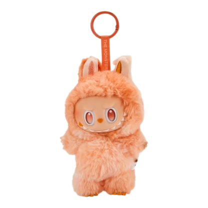 Squish Planet orange fuzzy Labubu monster pendant with plush ears and vinyl face, part of the Big into Energy series.
