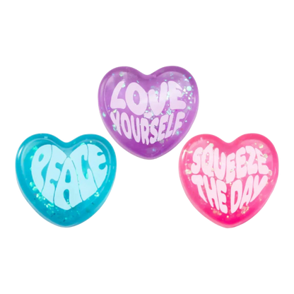 Squish Planet NeeDoh Good Vibes Only heart-shaped fidget toys in blue, purple, and pink with positive affirmations.