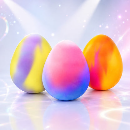 Squish Planet NeeDoh Dippin Dazzler egg fidget toys in vibrant marbled colors on a reflective surface.