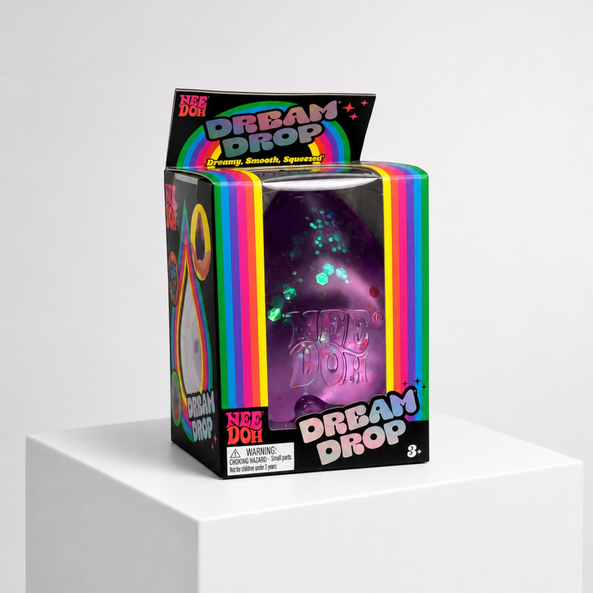 Squish Planet NeeDoh Dream Drop purple glittery squishy fidget toy in its original retail packaging box.