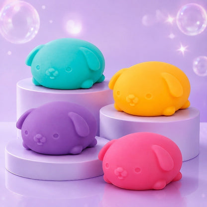 Squish Planet NeeDoh Funky Pup squishy fidget toys in teal, yellow, purple, and pink on display pedestals.