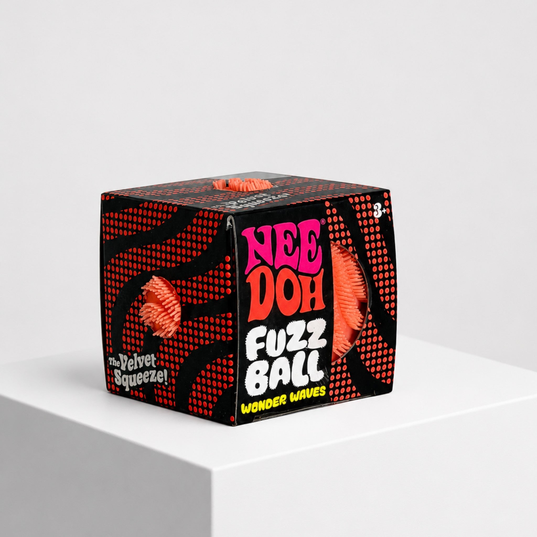Squish Planet NeeDoh Fuzz Ball Wonder Waves velvet squeeze fidget toy in black and orange display box
