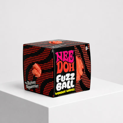 Squish Planet NeeDoh Fuzz Ball Wonder Waves velvet squeeze fidget toy in black and orange display box
