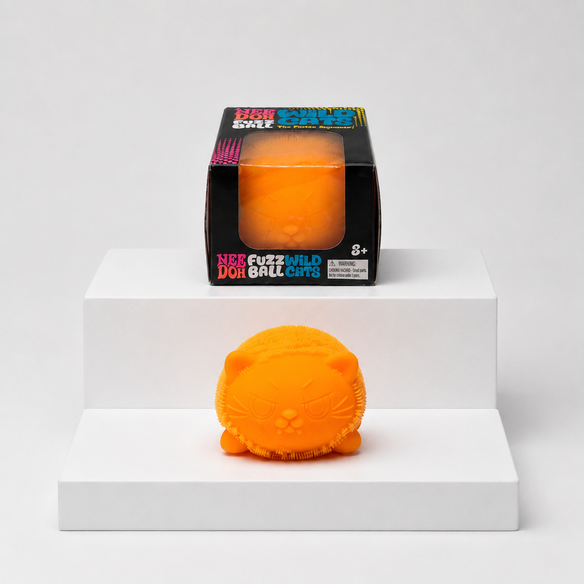 Orange NeeDoh Fuzz Ball Wild Cats squishy with matching retail package, front view