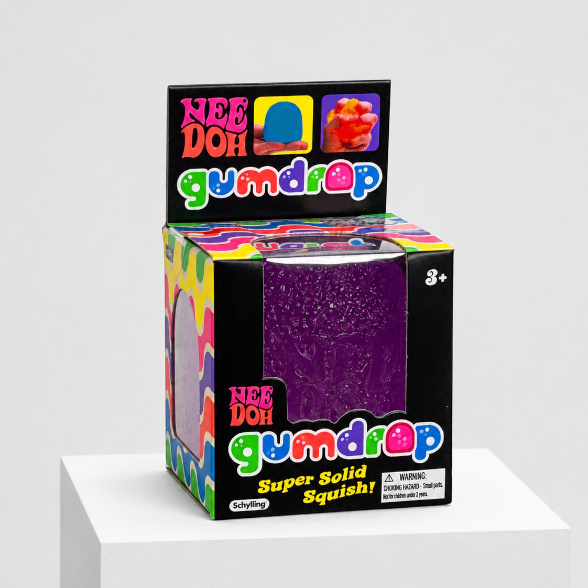 Squish Planet NeeDoh Gumdrop purple squishy fidget toy in its colorful candy-themed retail display box