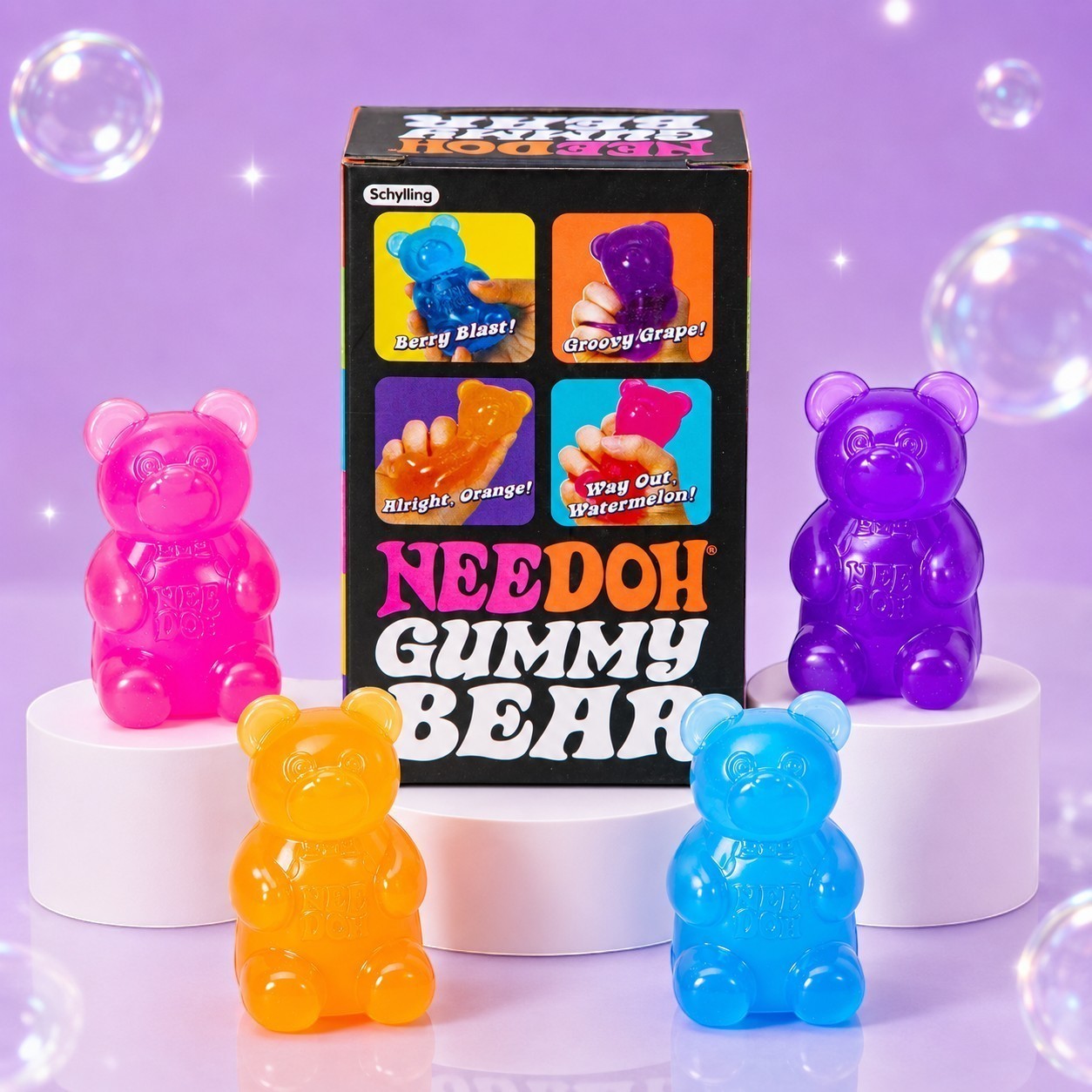 Squish Planet NeeDoh Gummy Bear fidget toys in pink, orange, blue, and purple with their display box on pedestals.