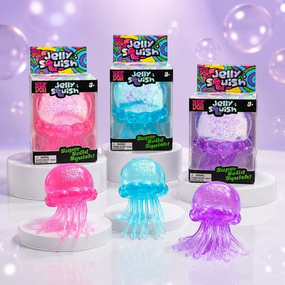 Squish Planet NeeDoh JellySquish fidget toys in pink, blue, and purple with glossy jellyfish bodies and stretchy tentacles.
