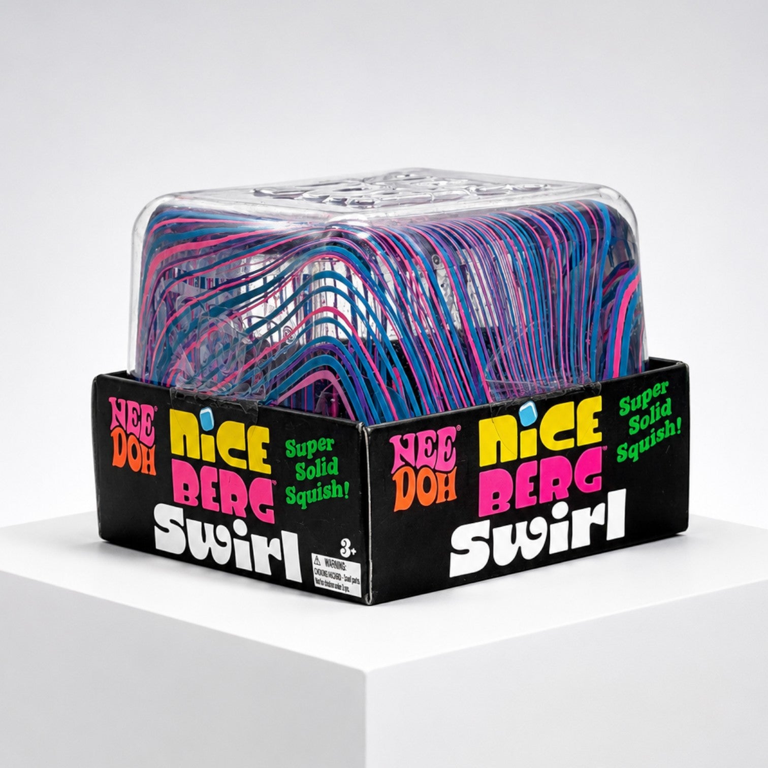 Squish Planet NeeDoh Jumbo Swirl Nice Berg fidget toy in its black display box with blue and pink swirl pattern.