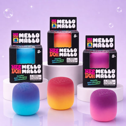 Squish Planet NeeDoh Mello Mallo color-changing squishy fidget toys in blue, orange, and pink on white pedestals.