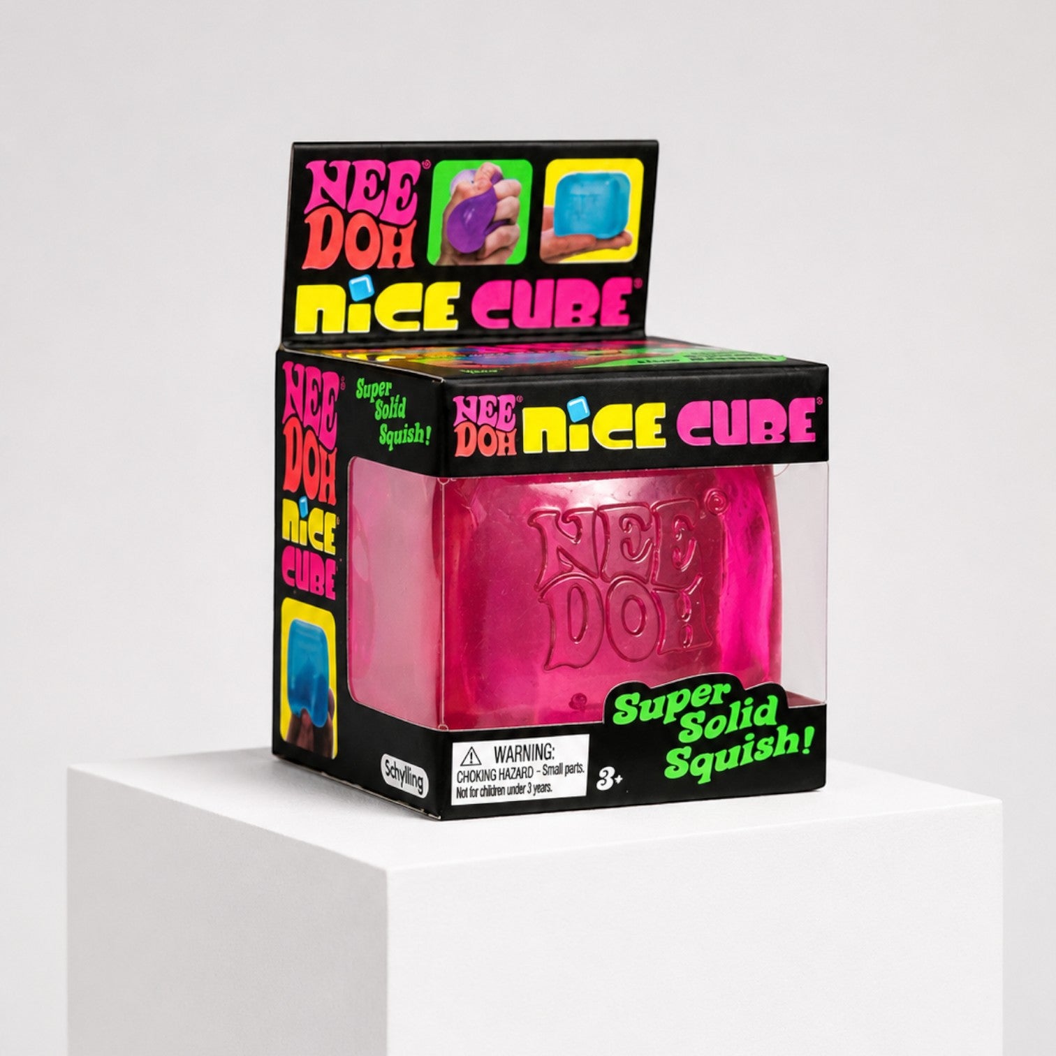 Squish Planet NeeDoh Nice Cube pink sensory fidget toy in its original retail packaging on a white display stand.