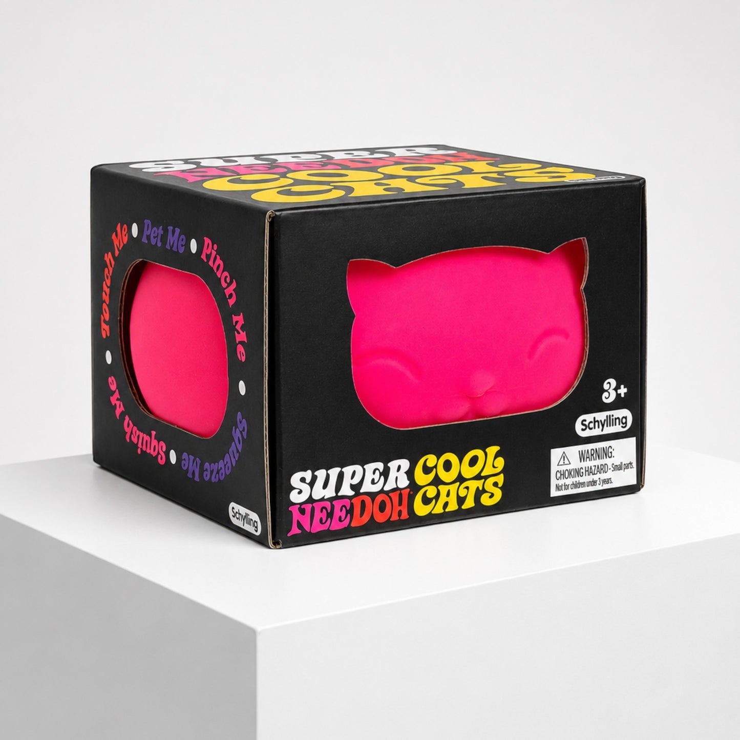 Squish Planet NeeDoh Super Cool Cat squishy fidget toy in bright pink inside its black display box on a white stand.