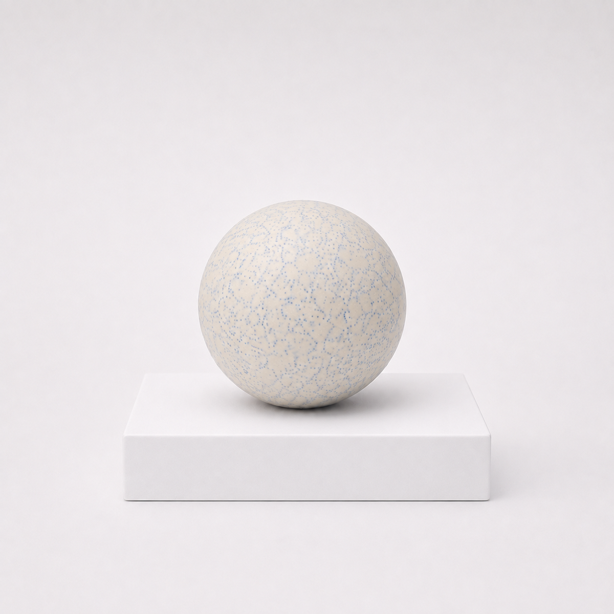 NeeDoh Snowball Crunch white squishy fidget toy with blue speckles