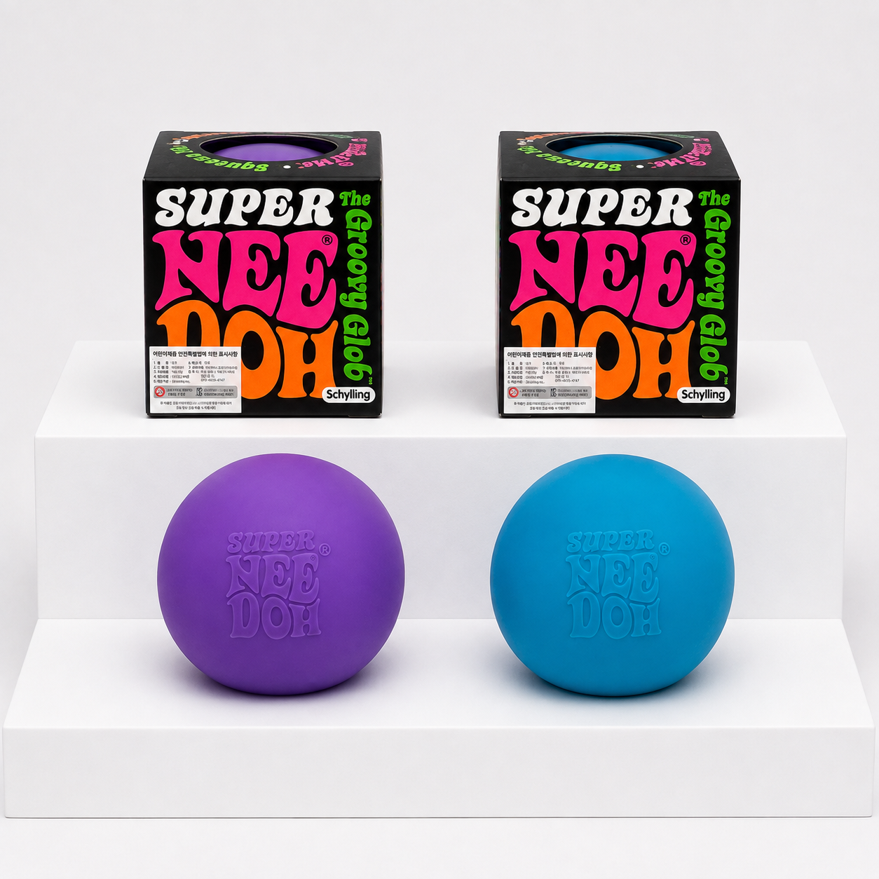 Purple and blue NeeDoh Super Groovy Glob Squishy Fidget Toys with boxes
