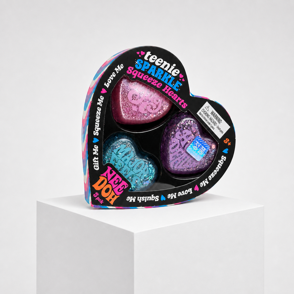 Squish Planet NeeDoh Teenie Sparkle Squeeze Hearts three-pack product image with full packaging visible.