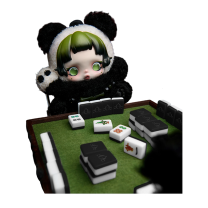 Squish Planet Skullpanda Lazy Panda plush doll pendant with green hair and big eyes, playing mahjong.