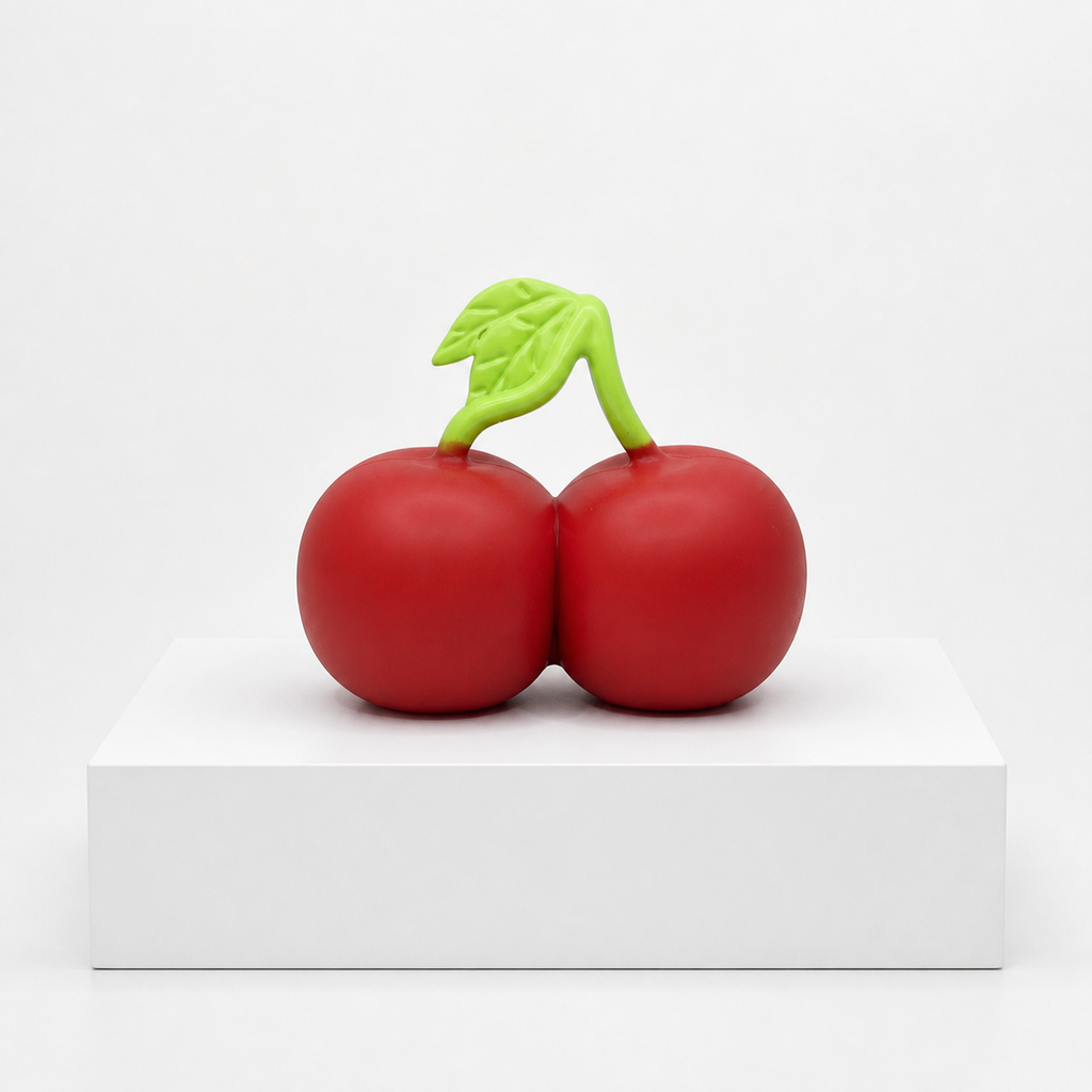 Loose Sunny Days Entertainment Squeeezy Cherries sensory fidget toy on a white display slab