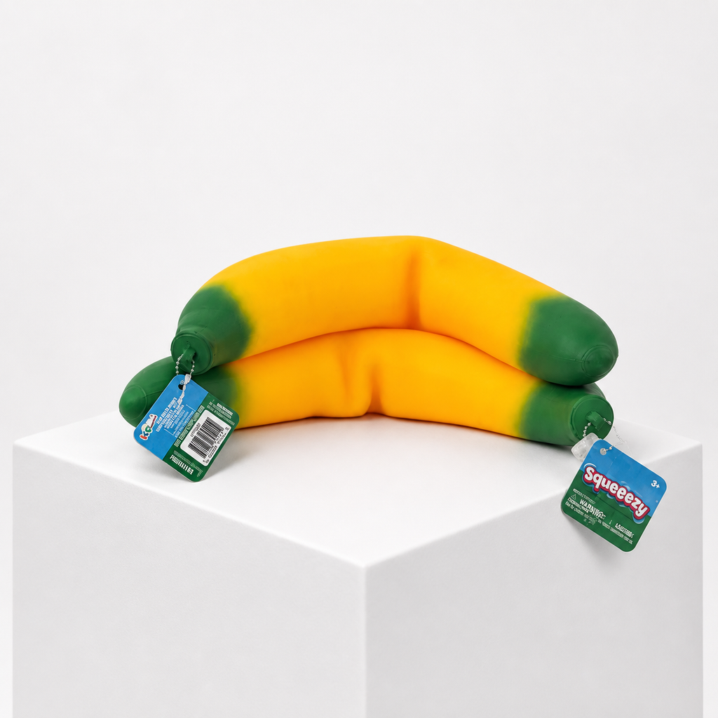 Sunny Days Entertainment Squeeezy Banana sensory fidget toy in orange and green with product tag.
